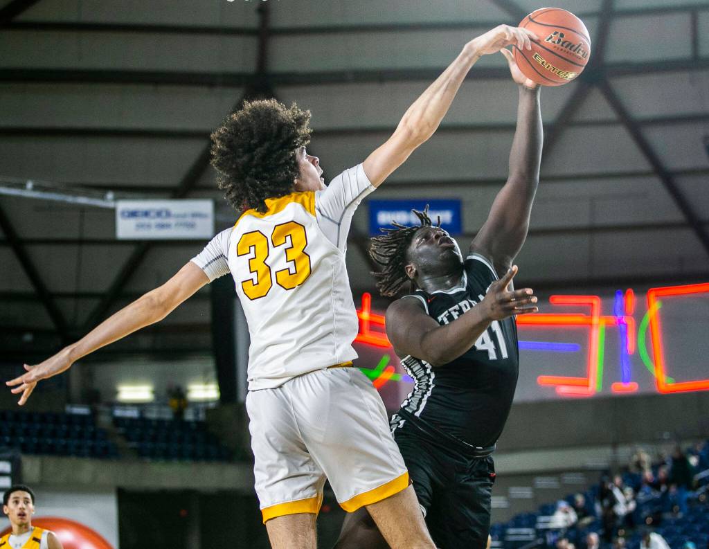 Mountlakes Zaveon Jones has his shot blocked during the 3A quarterfinal game against ODea on Thursday, March 2, 2023 in Tacoma, Washington. (Olivia Vanni / The Herald)