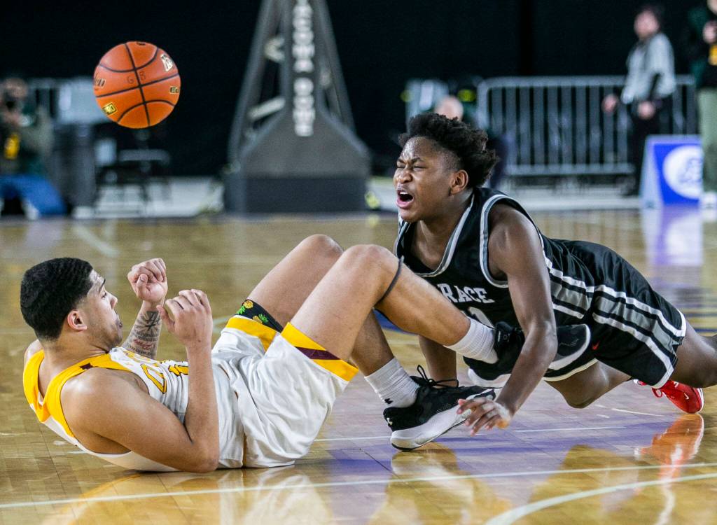 Mountlakes Rayshaun Connor grimaces while being kicked in the chest during the 3A quarterfinal game against ODea on Thursday, March 2, 2023 in Tacoma, Washington. (Olivia Vanni / The Herald)
