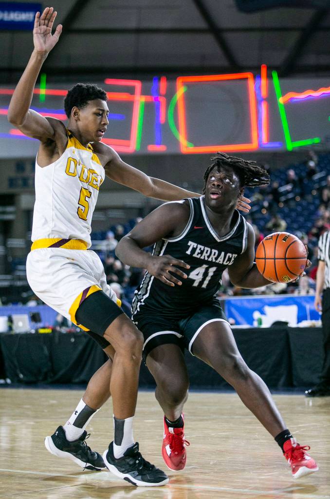 Mountlakes Zaveon Jones drives to the hoop during the 3A quarterfinal game against ODea on Thursday, March 2, 2023 in Tacoma, Washington. (Olivia Vanni / The Herald)