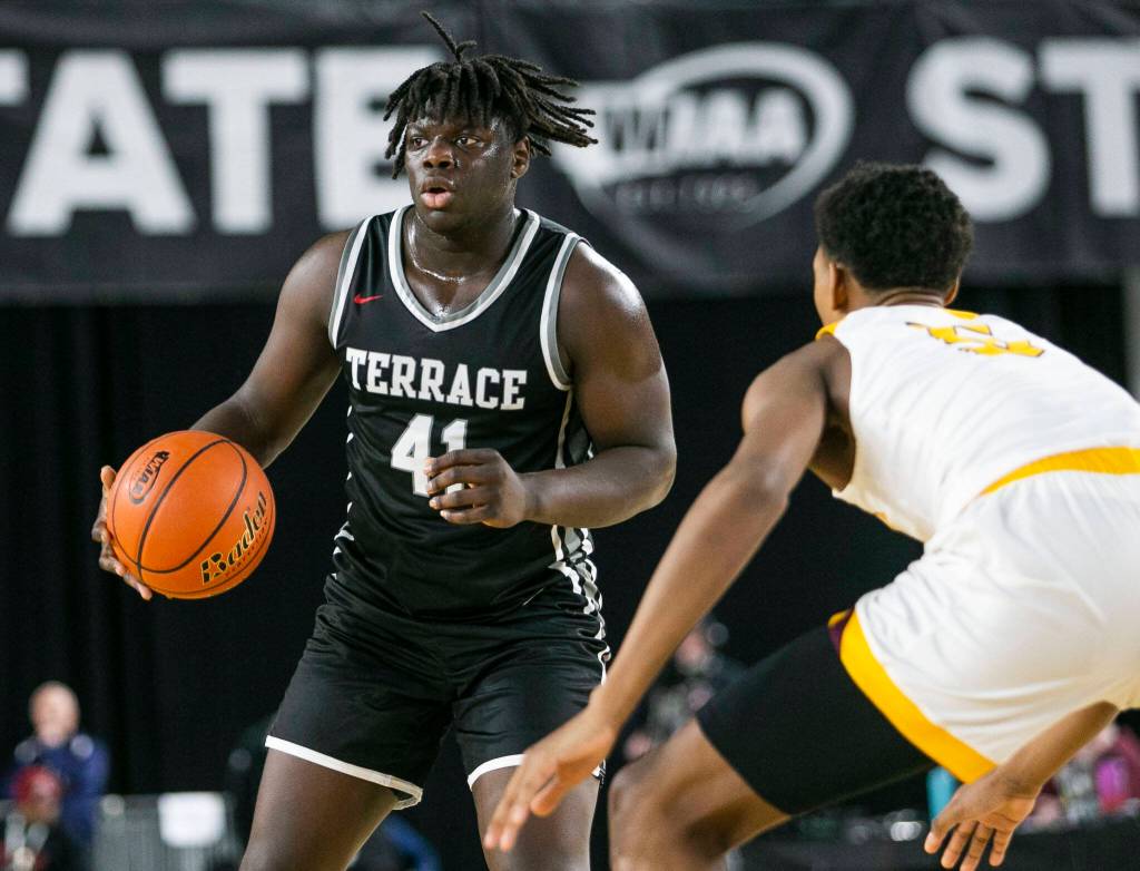 Mountlakes Zaveon Jones looks for an open teammate during the 3A quarterfinal game against ODea on Thursday, March 2, 2023 in Tacoma, Washington. (Olivia Vanni / The Herald)