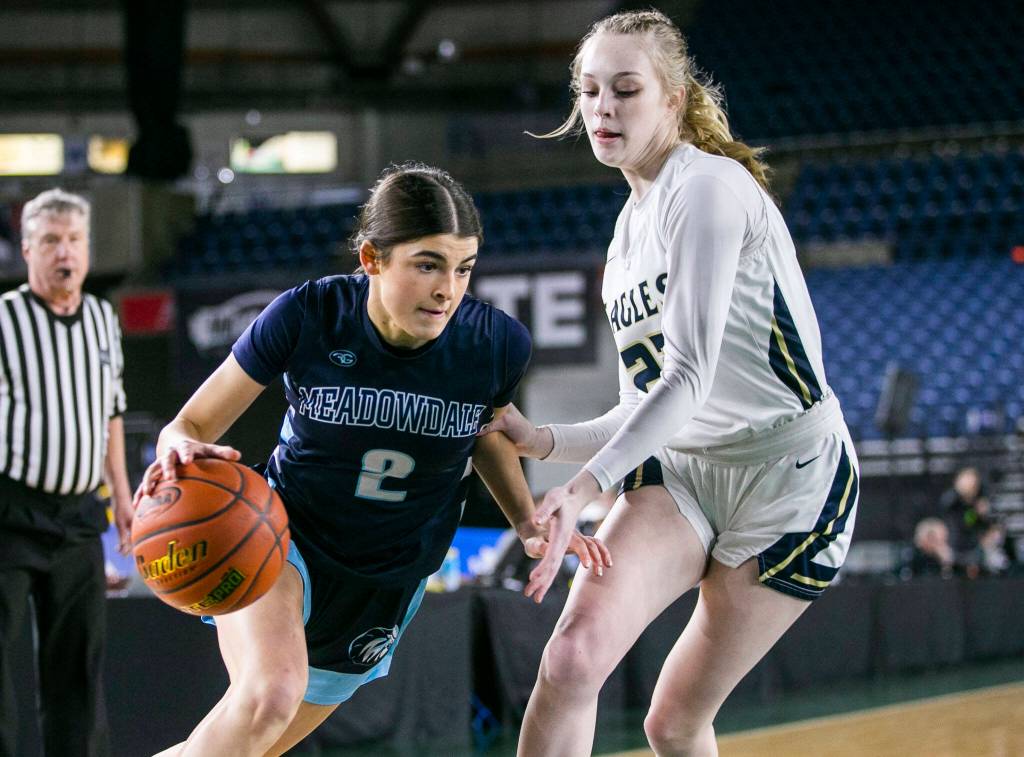 Meadowdales Gia Powel drives to the hoop during the 3A quarterfinal game against Arlington on Thursday, March 2, 2023 in Tacoma, Washington. (Olivia Vanni / The Herald)