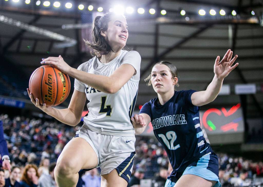 Arlingtons Maddy Fischer leaps to make a pass during the 3A quarterfinal game against Meadowdale on Thursday, March 2, 2023 in Tacoma, Washington. (Olivia Vanni / The Herald)