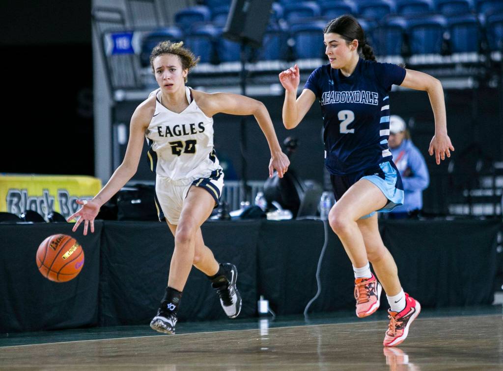 Arlingtons Samara Morrow takes the ball down the court during the 3A quarterfinal game against Meadowdale on Thursday, March 2, 2023 in Tacoma, Washington. (Olivia Vanni / The Herald)