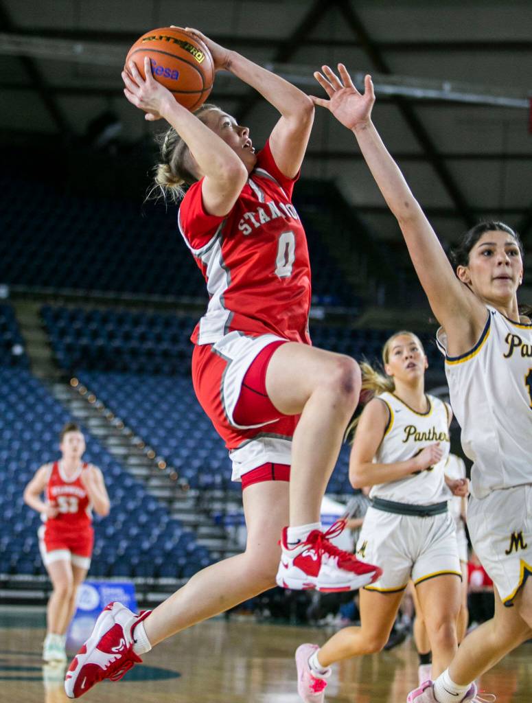 Stanwoods Grace Walker leaps to make a layup during the 3A quarterfinal game against Mead on Thursday, March 2, 2023 in Tacoma, Washington. (Olivia Vanni / The Herald)