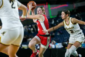 Stanwood’s Ellalee Wortham drives to the hoop during the 3A quarterfinal game against Mead on Thursday, March 2, 2023 in Tacoma, Washington. (Olivia Vanni / The Herald)