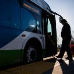 A bus driver steps onto a bus at the Blue Line stop at the Everett Transit Center in November in Everett. (Olivia Vanni / The Herald file photo)