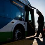 A bus driver steps onto their bus at the Blue Line stop at the Everett Transit Center on Tuesday, Nov. 15, 2022 in Everett, Washington. (Olivia Vanni / The Herald)