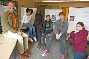 Bradley Barton with graduates of his Climate Crisis Solutions class at Maplewood Parent Cooperative school on Feb. 22, 2023 in Edmonds, Washington. From left, the students are Maedot Yoseph, Talea Mustefa, Jaxon Kennard, M.J. Pankow and Ava Woodsum. (Julie Titone)