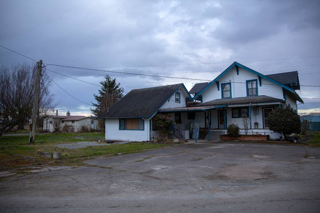 An old farmhouse at Johnson Farm is seen on Tuesday, March 7, 2023, on the west end of Stanwood, Washington. The farm buildings will be razed, and a portion of the farmland will be flooded to provide habitat for fish and other wildlife. (Ryan Berry / The Herald)