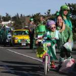 People clad in green pose for photos during a past St. Patricks Day parade in Oak Harbor. (Whidbey News-Times, file)