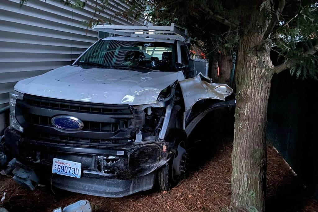 The stolen City of Stanwood work truck that crashed into Carrolls Creek Landing on Monday, March 6, 2023, in Marysville, Washington. The vehicle struck a gas meter which caused four housing buildings to evacuate.(Snohomish Country Sheriffs Office)