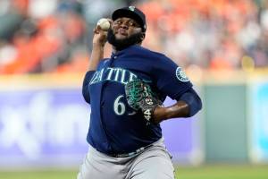 FILE -Seattle Mariners relief pitcher Diego Castillo (63) delivers a pitch against the Houston Astros during the seventh inning in Game 1 of an American League Division Series baseball game in Houston, Tuesday, Oct. 11, 2022. Reliever Diego Castillo and the Seattle Mariners went to salary arbitration Tuesday, Jan. 31, 2023 with the pitcher asking for $3,225,000 and the team offering $2.95 million.(AP Photo/Kevin M. Cox, File)