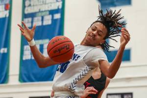 EC’s Damajio Merritt (20) fights for the ball during a men’s game between the Everett Community College Trojans and Edmonds College Tritons at Seaview Gymnasium at Edmonds College in Lynnwood, Washington on Wednesday Jan. 25, 2023. The Tritons won, 91-84. (Annie Barker / The Herald)