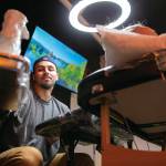 Tattoo artist Ernesto Nesto Hurtado in his Lynnwood studio, Wicked Boy Tattoo. (Ryan Berry / The Herald)