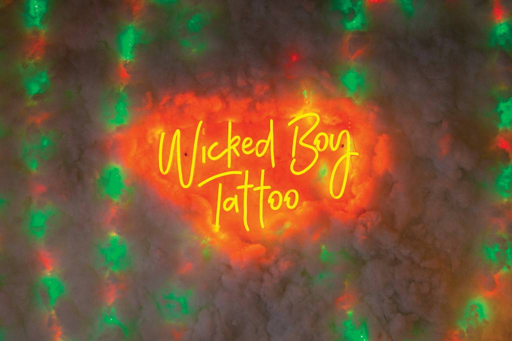 A sign on the wall at Hurtados studio in Lynnwood. (Ryan Berry / The Herald)