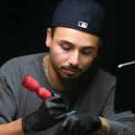 Hurtado works in a tattoo style called fine line. (Ryan Berry / The Herald)