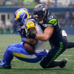 Seattle Seahawks linebacker Cody Barton tackles Los Angeles Rams running back Cam Akers during a game Jan. 8 in Seattle. Barton is one of 20 unrestricted free agents from Seattle. (AP Photo/Abbie Parr)