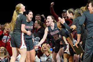 Washington State celebrates a 3-point basket by guard Charlisse Leger-Walker, second from left, during the second half of an NCAA college basketball game against UCLA in the finals of the Pac-12 women's tournament Sunday, March 5, 2023, in Las Vegas. (AP Photo/David Becker)