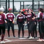 Cascades Abby Surowiec is congratulated by her teammates after hitting a home run during the game against Lakewood on Monday, March 13, 2023 in Everett, Washington. (Olivia Vanni / The Herald)