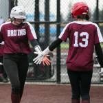 Cascades Sophia Tripp high-fives a teammate during the game against Lakewood on Monday, March 13, 2023 in Everett, Washington. (Olivia Vanni / The Herald)