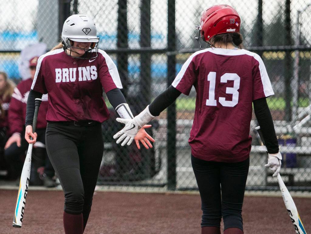Cascades Sophia Tripp high-fives a teammate during the game against Lakewood on Monday, March 13, 2023 in Everett, Washington. (Olivia Vanni / The Herald)
