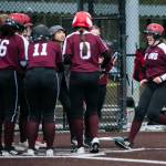 Cascades Alexa Hamshaw is congratulated by her teammates after hitting a home run during the game against Lakewood on Monday, March 13, 2023 in Everett, Washington. (Olivia Vanni / The Herald)