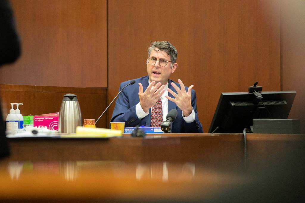 Dr. J. Matthew Lacy, Chief Medical Examiner for Snohomish County, answers preliminary questions from the state regarding his qualifications and experience as a medical examiner during the trial of Richard Rotter on Thursday, March 23, 2023, at Snohomish County Superior Court in Everett, Washington. (Ryan Berry / The Herald)