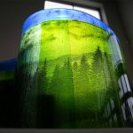 Window light shines through a piece by Steve Klein during the setup for A Precarious Edge at Schack Art Center on Sunday, March 19, 2023, in Everett, Washington. (Ryan Berry / The Herald)