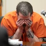 Richard Rotter puts his head in his hands after entering a not-guilty plea on all three charges against him on April 25, 2022, at Snohomish County Superior Court in Everett, Washington. Rotter has been charged with the murder of Everett Police Officer Dan Rocha. (Ryan Berry / The Herald)