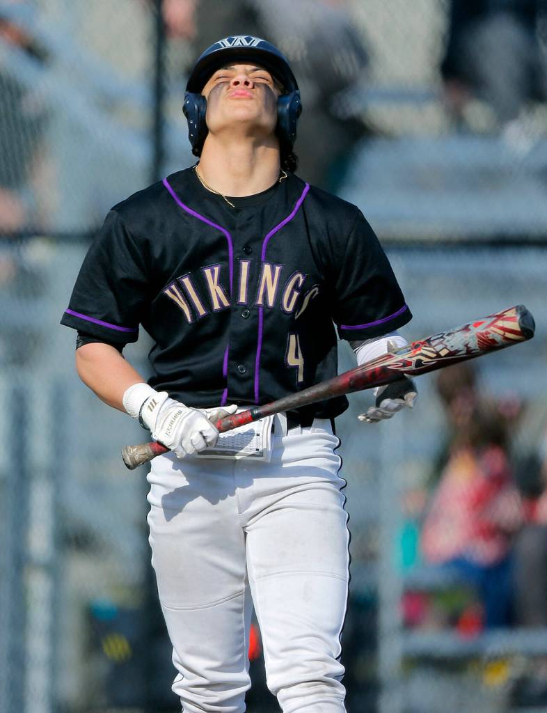 Lake Stevens’ Bryce Moser reacts with exasperation after fouling off a pitch during a game against Lynnwood on Friday, March 17, 2023, at Lake Stevens High School in Lake Stevens, Washington. (Ryan Berry / The Herald)