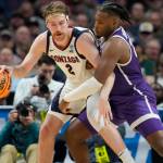 Gonzaga forward Drew Timme, left, looks to move the ball as Grand Canyon forward Yvan Ouedraogo defends in the second half of a first-round college basketball game in the men's NCAA Tournament, Friday, March 17, 2023, in Denver. (AP Photo/David Zalubowski)