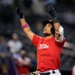 Great Britain's Harry Ford celebrates after hitting a solo home run against Colombia during the seventh inning of a World Baseball Classic game in Phoenix, Monday, March 13, 2023. (AP Photo/Godofredo A. Vásquez)