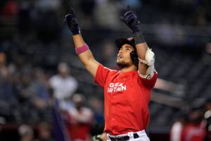 Great Britain's Harry Ford celebrates after hitting a solo home run against Colombia during the seventh inning of a World Baseball Classic game in Phoenix, Monday, March 13, 2023. (AP Photo/Godofredo A. Vásquez)