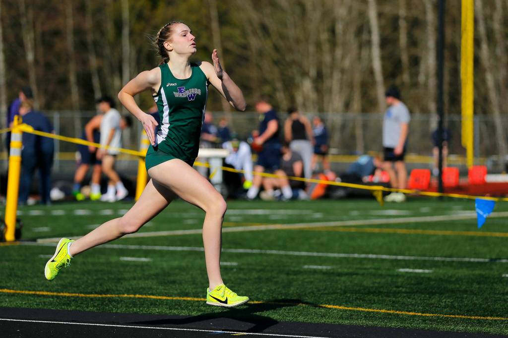 An Edmonds-Woodway runner makes the final turn in the 800 meter run during the Chuck Randall Invite at Arlington High School on Saturday, March 18, 2023, in Arlington, Washington. (Ryan Berry / The Herald)