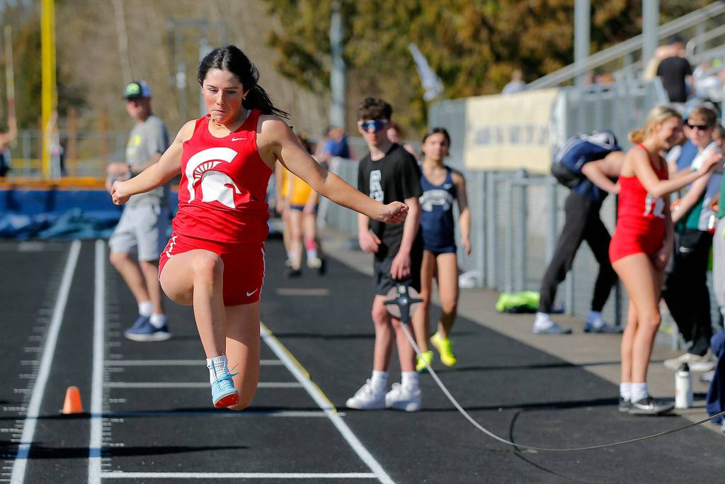 A Stanwood triple jumper makes an attempt during the Chuck Randall Invite at Arlington High School on Saturday, March 18, 2023, in Arlington, Washington. (Ryan Berry / The Herald)