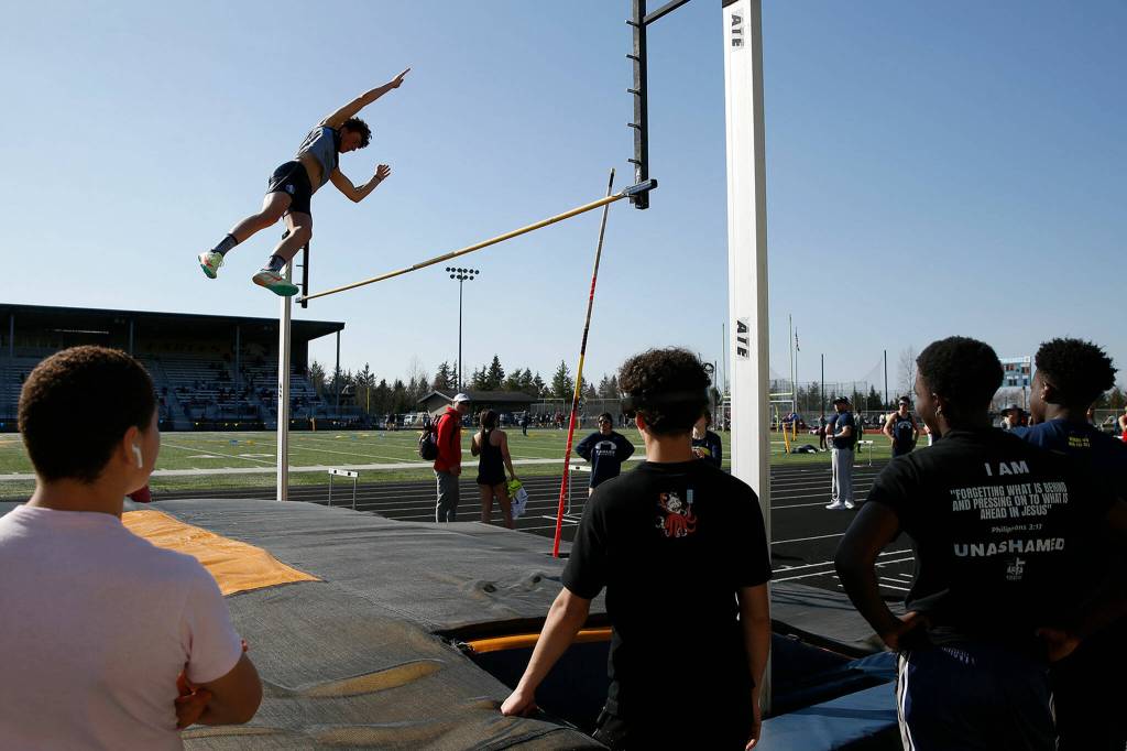 A pole-vaulter completes a vault during the Chuck Randall Invite at Arlington High School on Saturday, March 18, 2023, in Arlington, Washington. (Ryan Berry / The Herald)