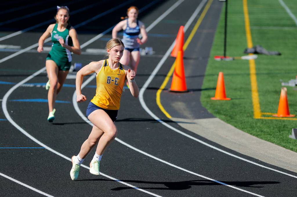 Runners take off in the 400 meter dash during the Chuck Randall Invite at Arlington High School on Saturday, March 18, 2023, in Arlington, Washington. (Ryan Berry / The Herald)