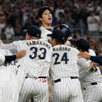 Japan pitcher Shohei Ohtani (center) celebrates with teammates after defeating the United States in the World Baseball Classic championship game Tuesday in Miami. (AP Photo/Marta Lavandier)