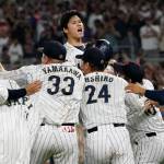 Japan pitcher Shohei Ohtani (16) celebrates after defeating the United States at the World Baseball Classic final game, Tuesday, March 21, 2023, in Miami. (AP Photo/Marta Lavandier)