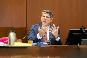 Dr. J. Matthew Lacy, Chief Medical Examiner for Snohomish County, answers preliminary questions from the state regarding his qualifications and experience as a medical examiner during the trial of Richard Rotter on Thursday, March 23, 2023, at Snohomish County Superior Court in Everett, Washington. (Ryan Berry / The Herald)