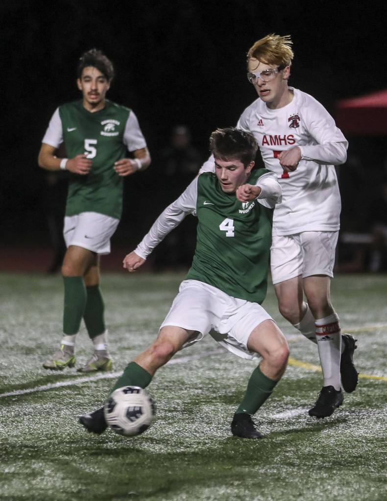 Edmonds-Woodways Anthony Pellegrini (4) and Archbishop Murphys Sean Balen (7) collide during a boys soccer match between Archbishop Murphy and Edmonds-Woodway at Edmonds-Wooday High School in Edmonds, Washington on Tuesday, March 28, 2023. Edmonds-Woodway won, 4-1. (Annie Barker / The Herald)
