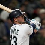 Seattle Mariners' Ty France watches his double to center field against the Cleveland Guardians during the sixth inning during an opening day baseball game Thursday, March 30, 2023, in Seattle. (AP Photo/Lindsey Wasson)