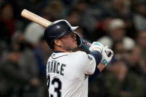 Seattle Mariners' Ty France watches his double to center field against the Cleveland Guardians during the sixth inning during an opening day baseball game Thursday, March 30, 2023, in Seattle. (AP Photo/Lindsey Wasson)
