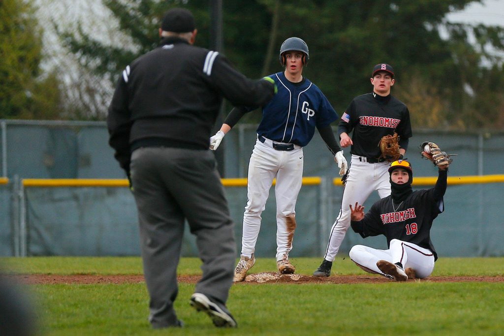 Glacier Peaks Logan Hall is called out on a close play at second against Snohomish on Friday, March 31, 2023, at Earl Torgeson Field in Snohomish, Washington. (Ryan Berry / The Herald)