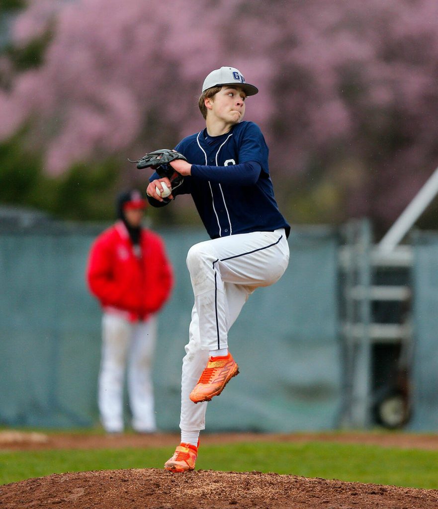 Glacier Peaks Owen Gluth winds up to deliver a pitch against Snohomish on Friday, March 31, 2023, at Earl Torgeson Field in Snohomish, Washington. (Ryan Berry / The Herald)