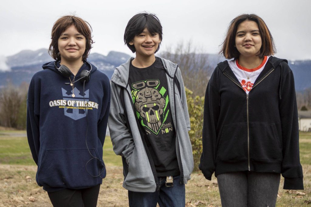 Three of Khrista Bills children pose for a photo near the Sauk-Suiattle Reservation in Darrington, Washington on Thursday, March 23, 2023. (Annie Barker / The Herald)