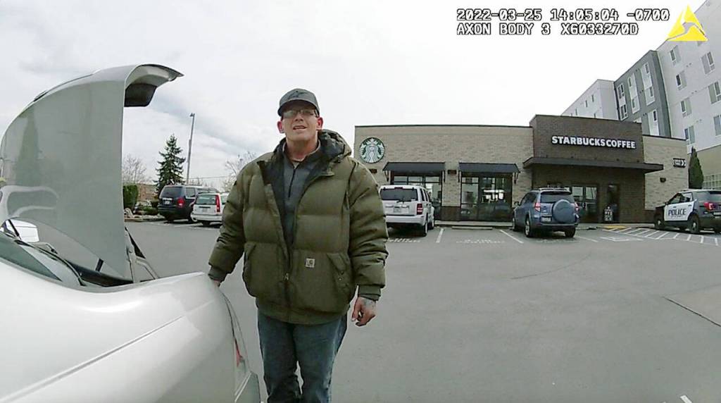 From the bodycam of Everett police officer Dan Rocha, Richard Rotter explains his possession of a firearm minutes before he allegedly shot and killed Rocha in a Starbucks parking lot in north Everett on March 25, 2022. (Everett Police Department)