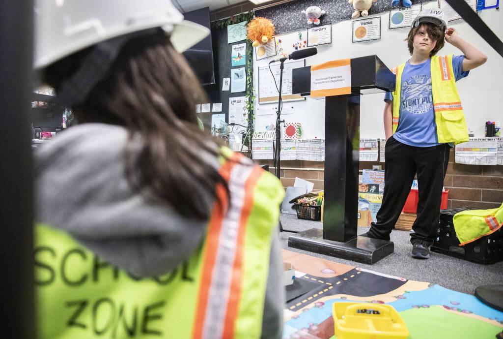 Chase Landis and Atticus Labor present their traffic solution to their class at Hazelwood Elementary School at Hazelwood Elementary School on Wednesday, March 29, 2023, in Lynnwood, Washington. (Olivia Vanni / The Herald)