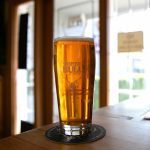 Three Bulls flagship IPA, the first beer they ever made, sits on a table at the new tap house on Wednesday, April 19, 2023, in Snohomish, Washington. (Ryan Berry / The Herald)