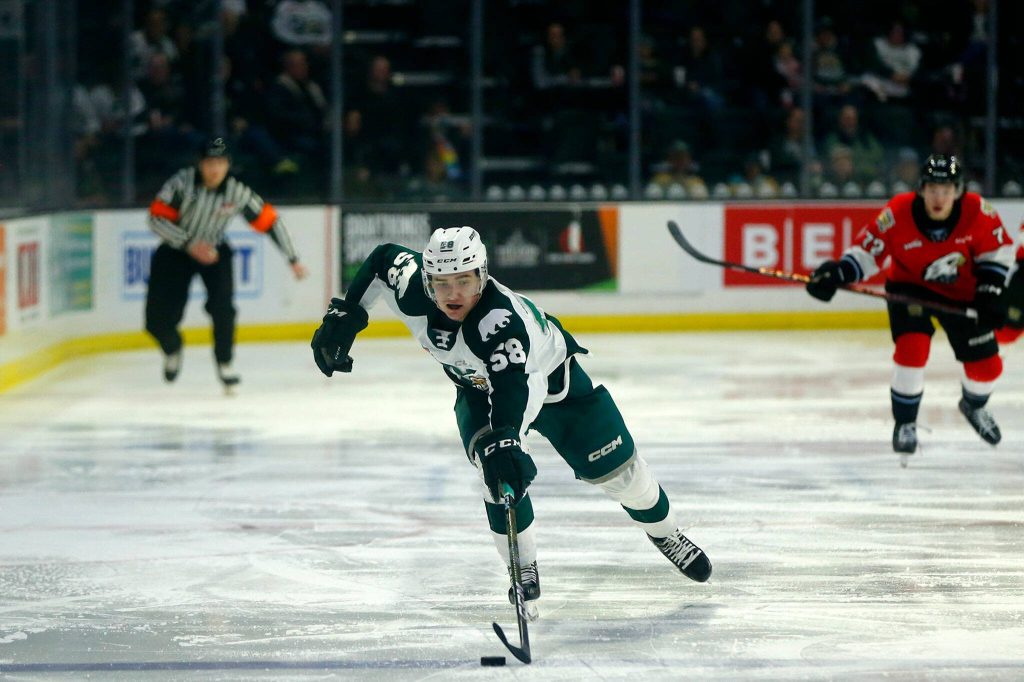 Everett Silvertips Kyan Grouette chases down a long outlet pass during game three of a playoff series against the Portland Winterhawks on Monday, April 3, 2023, at Angel of the Winds Arena in Everett, Washington. (Ryan Berry / The Herald)